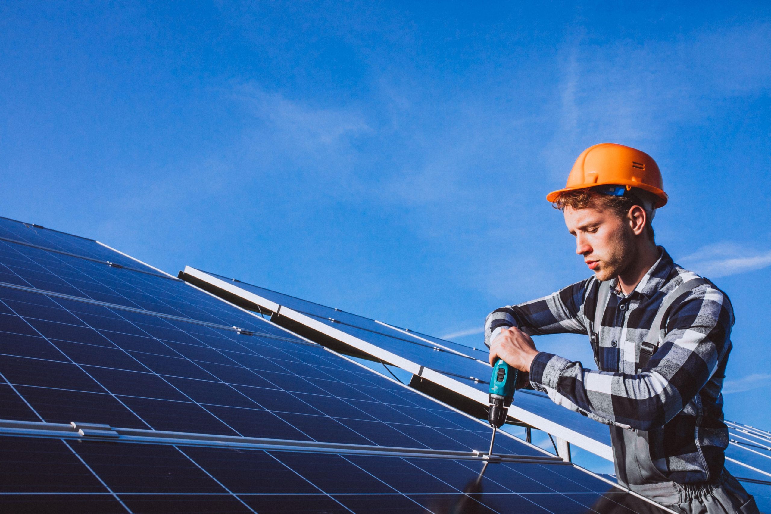man-worker-firld-by-solar-panels-min image Guardian Home Pro solar installation in Georgia