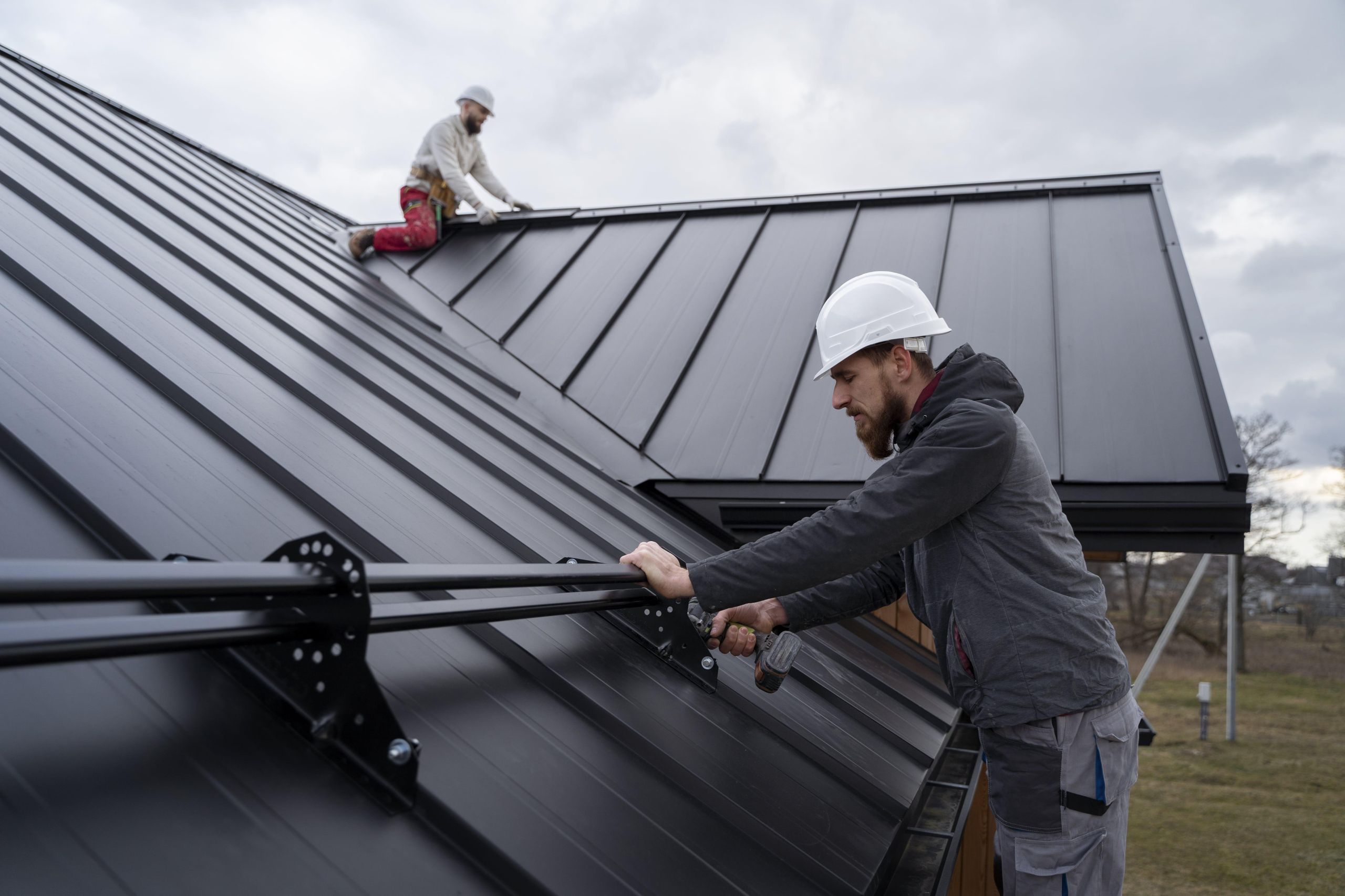 medium-shot-men-working-roof-together-min image Roof replacement project in South Carolina by Guardian